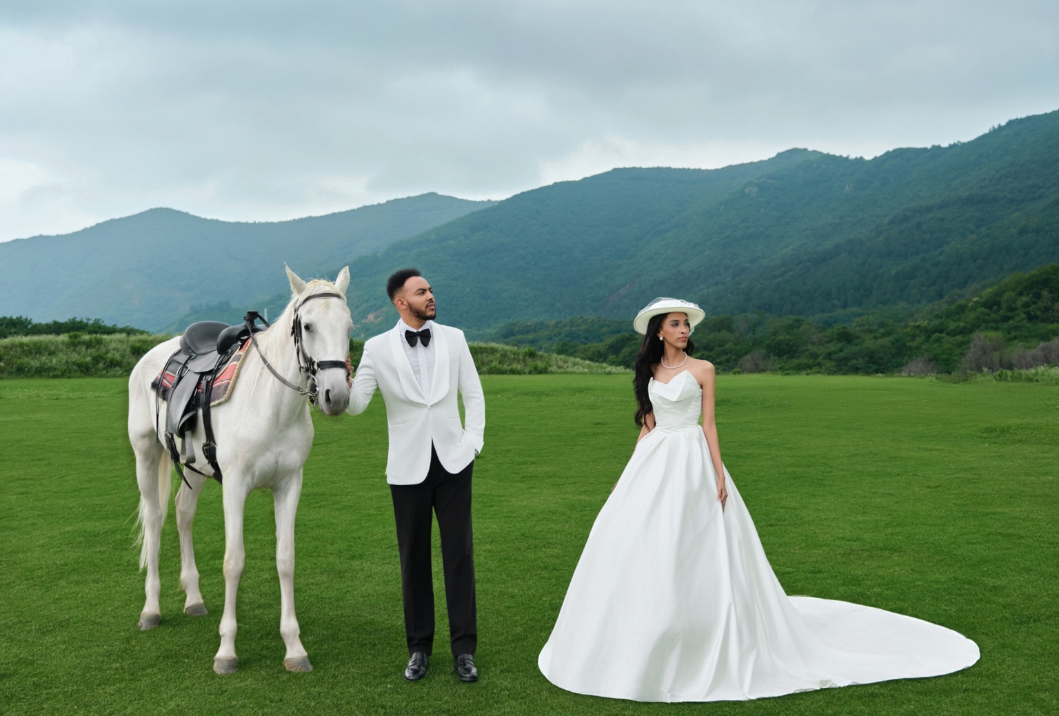 Lydia and Israel together beside a white horse