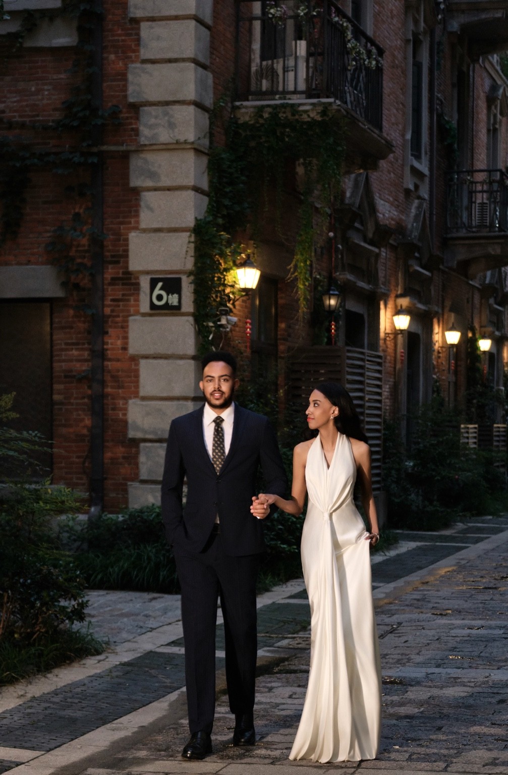 Lydia and Israel walking together at night