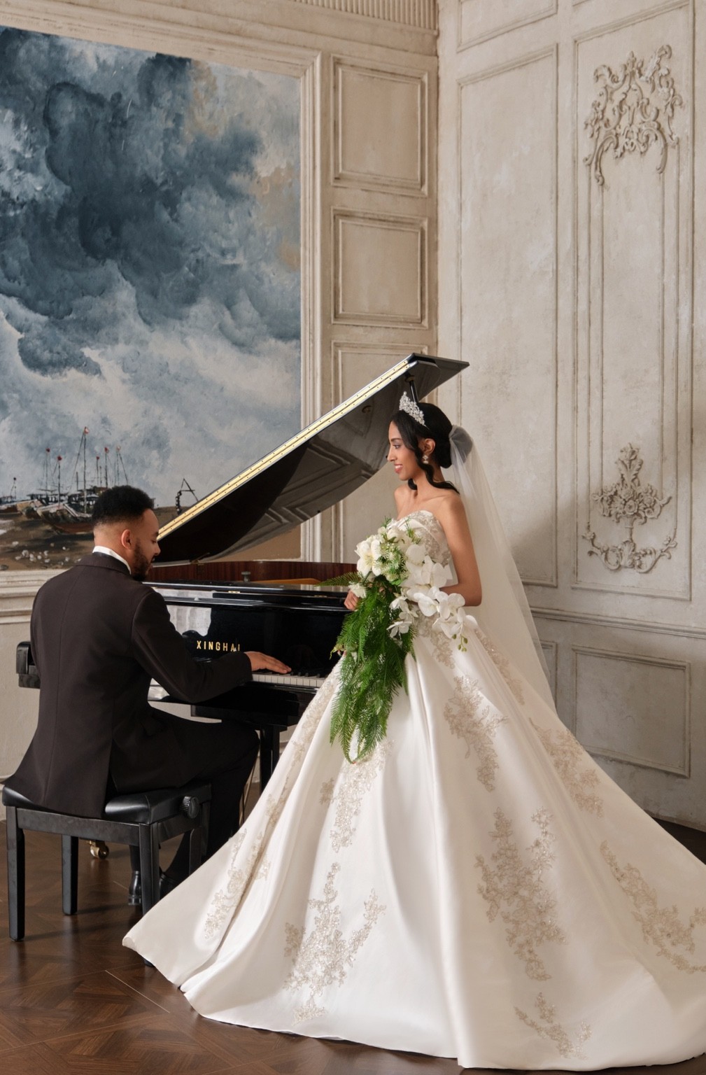 Israel at the piano with Lydia in her wedding dress